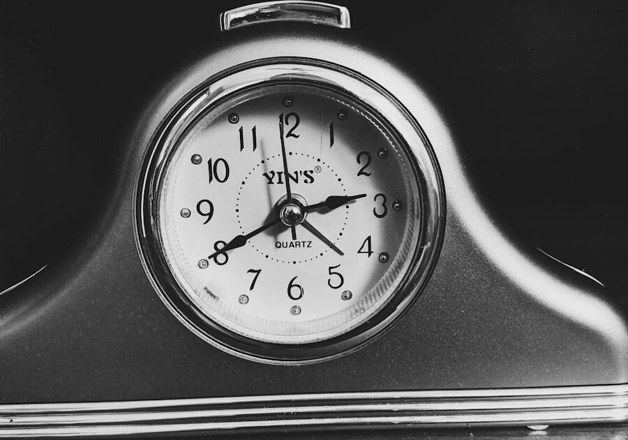 black and white analog alarm clock